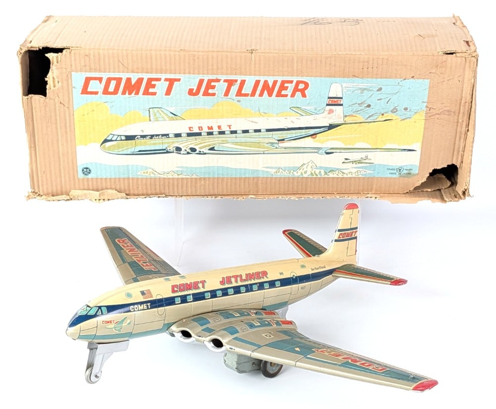 Yonezawa Tin Friction Comet Jetliner Airplane with Box: Yonezawa tin friction Comet Jetliner with the original box. The airplane has some scuff marks and minor scratches. the box has some wear and tear from storage and handling. Overall very good condition