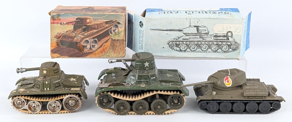 (3) German and Russian Military Tanks: Includes (2) Gama tanks (one including partial box) and a Russian tank with reproduction box. The Gama tanks are tin and the Russian is die-cast. The windup works on the smaller GAMA tank, the larger