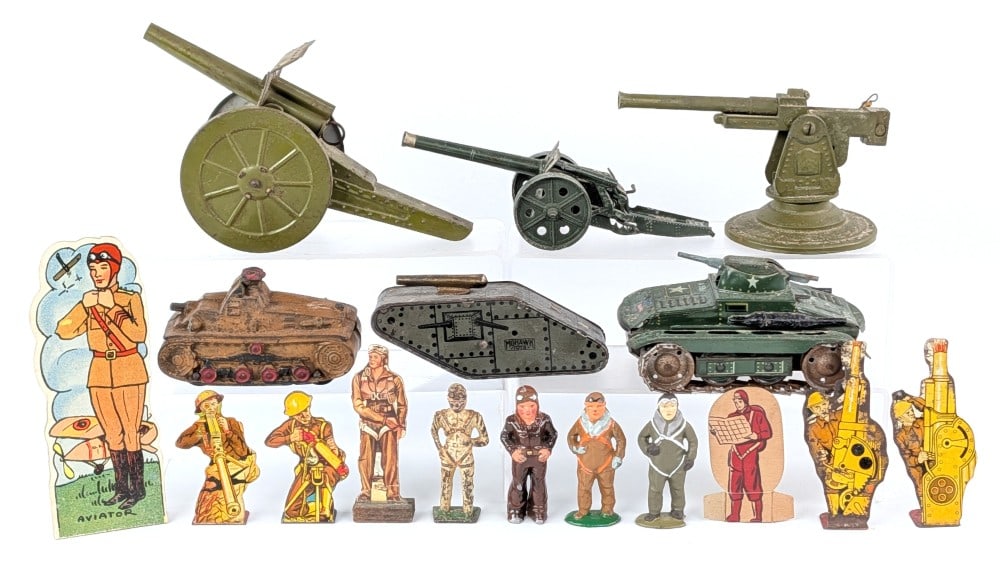 Vintage Military Toys: Includes soldiers, tanks, and cannons. A great assortment of toys. Items show some wear from play / age. The largest cannon measures 8-1/2" long.