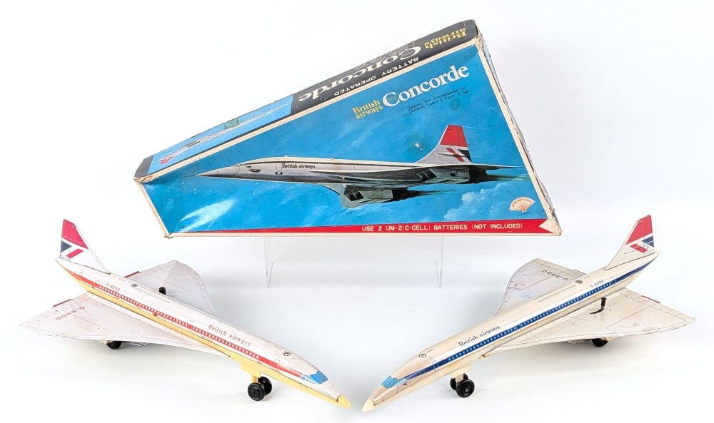 (2) Japan Tin Battery Op British Airway Concorde Airplanes: (2) Japan tin battery operated British Airways Concorde airplanes. The one comes with an original box. The planes show discoloration, scratches, and wear from play and age. Each measures