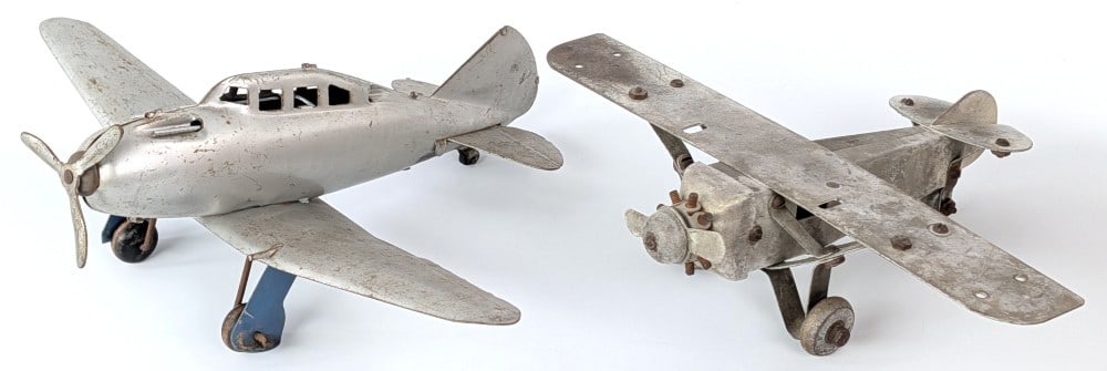 Metalcraft Spirit of St. Louis Airplane and Wyandotte Airplane: Metalcraft Spirit of St. Louis airplane and Wyandotte airplane. Both showing paint loss and wear from play and age. Largest wingspan measures approximately 13" long.?