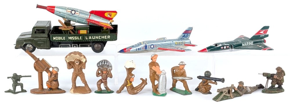Japan Tin Mobile Missile Launcher Truck, Jets, and Toy Soldiers: Includes Japan tin friction Mobile Missile Launcher truck, Marine jet, Navy jet, and assortment of toy soldiers. The two jets are missing there wheels. The soldiers includes paratroopers, machine gunn