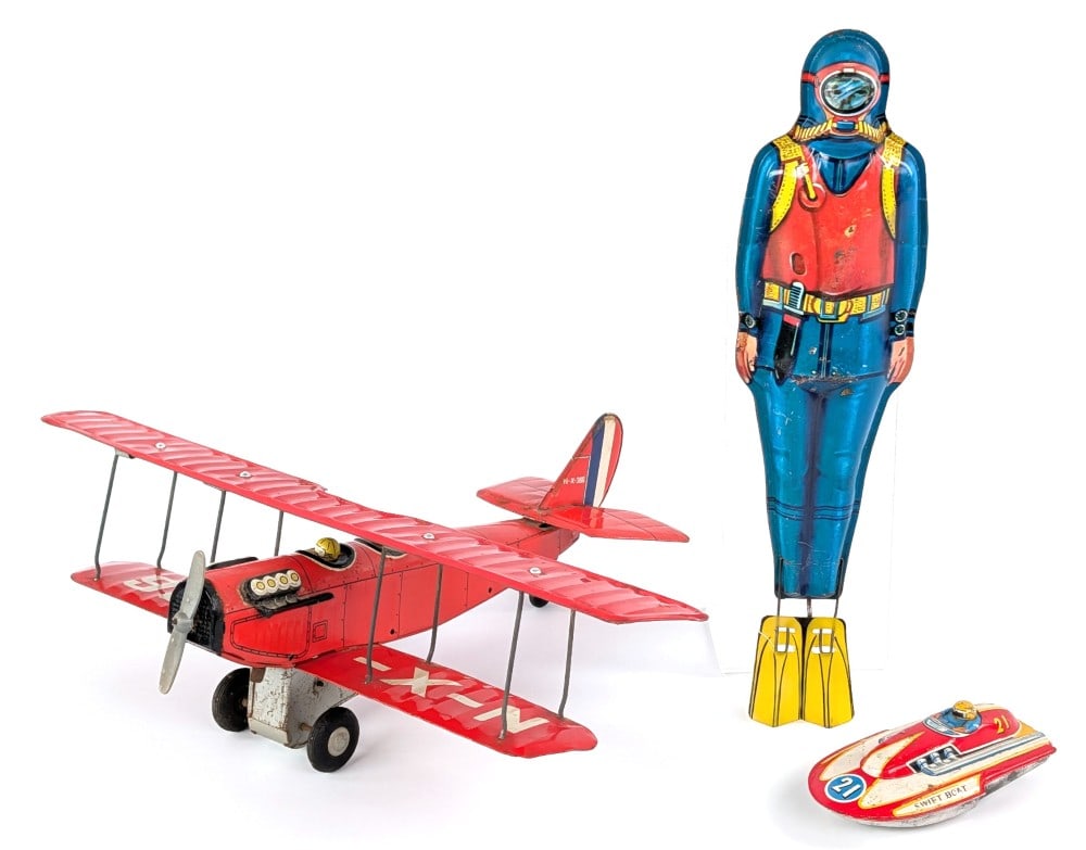 Japan Tin Scuba Diver, Curtiss Jenny, and Swift Boat: Includes U.S.A. J. Chein tin windup Scuba Diver, Japan tin friction Curtiss Jenny Trainer bi-plane, and Japan tin friction Swift Boat. All toys function as they should. All show some wear from play an
