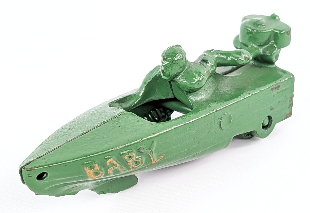Hubley Cast Iron Baby Speed Boat: Hubley cast iron Baby speed boat. Green in color with embossed gold painted "Baby" on each side of the boat. More than likely an older repaint showing wear from age. Measures approximately 4-1/4" long