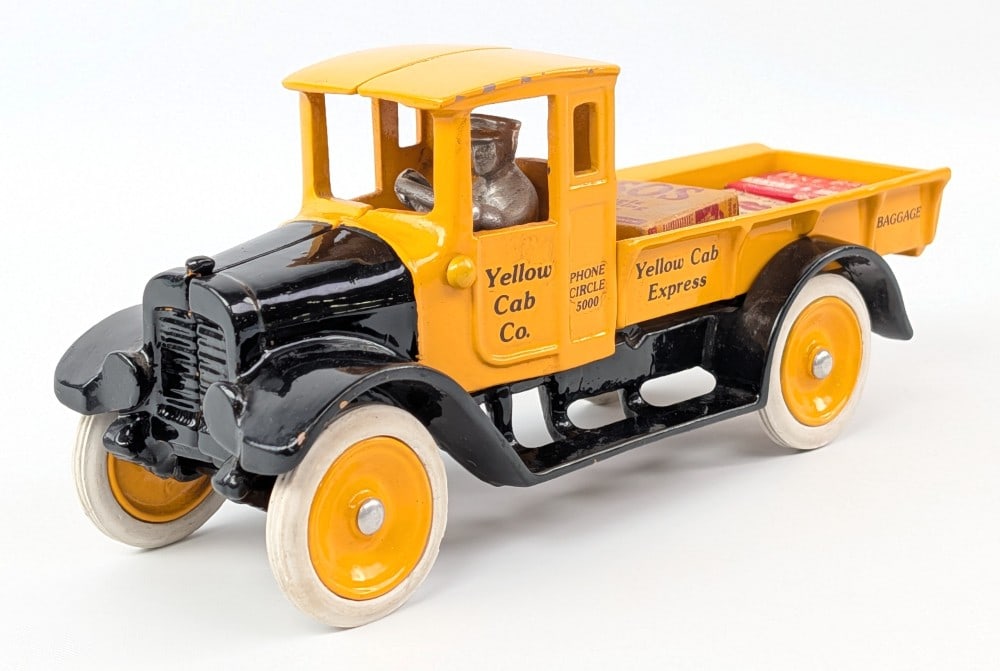 Arcade Cast Iron Yellow Cab Co. Express Baggage Truck: Arcade cast iron Yellow Cab Co. Express Baggage truck. A very nice restorated example. Good condition with some dust and tiny paint chips on the edges. Measures approximately 10" long.?