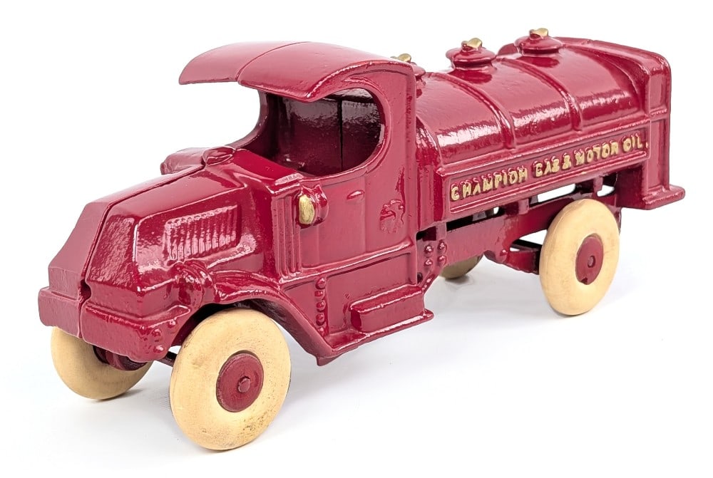 Champion Cast Iron Champion Gas & Motor Oil Tank Truck: Champion cast iron Mack Champion Gas & Motor Oil tanker truck. A very nice restored example. Some minor wear to the wheels, but overall very good condition. Measures approximately 8" long.