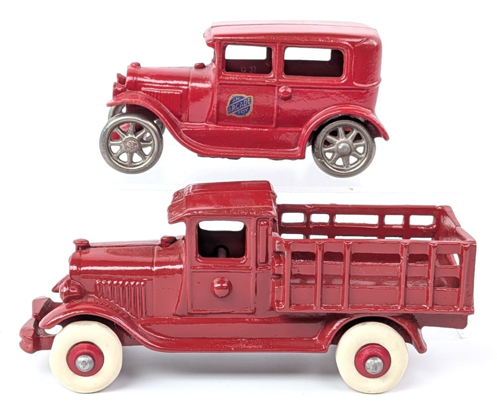 Cast Iron Arcade Ford Sedan and AC Williams Stake Truck: Arcade cast iron ford Sedan and AC Williams cast iron stake bed truck. Both in nicely restored condition. Some scuff marks to the roof of the truck. The truck measures approximately 7" long.