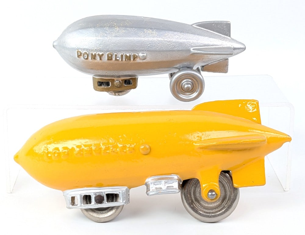 Kenton Los Angeles Blimp and Pony Blimp: Kenton Los Angeles blimp and Kenton or Dent Pony Blimp both repainted / restored. The Los Angeles blimp needs some work with the axles to finish. The wheels for the LA aren't correct. Largest measures