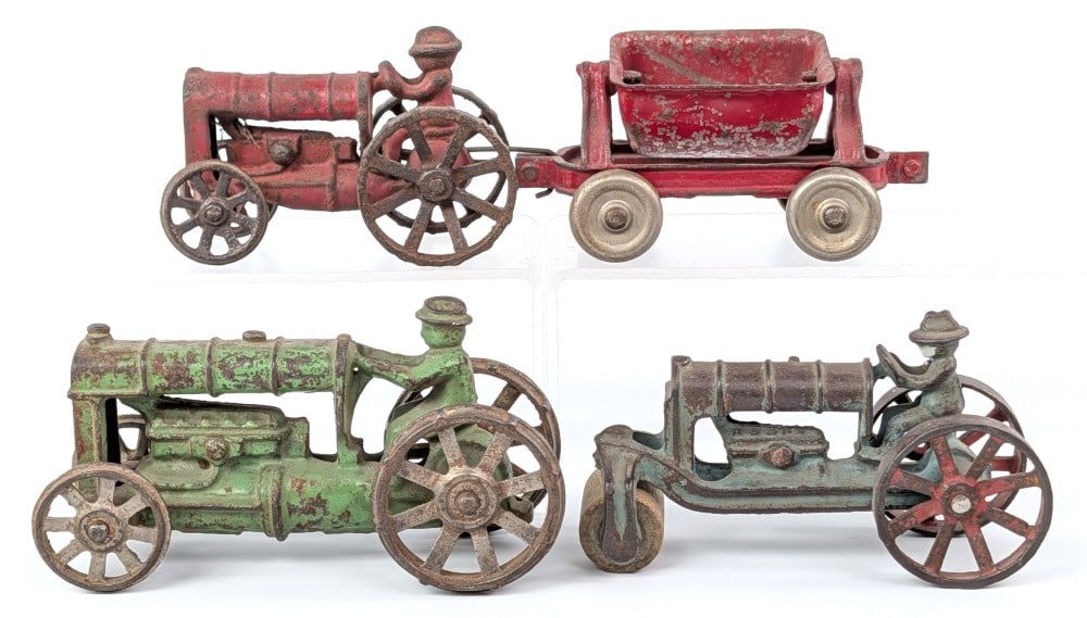 AC Williams Cast Iron Tractors and Cart: AC Williams cast iron tractors and side dump cart. Includes steam roller tractor, green tractor on steel wheels, red tractor on steel wheels, and red side dump cart. Original condition with paint loss