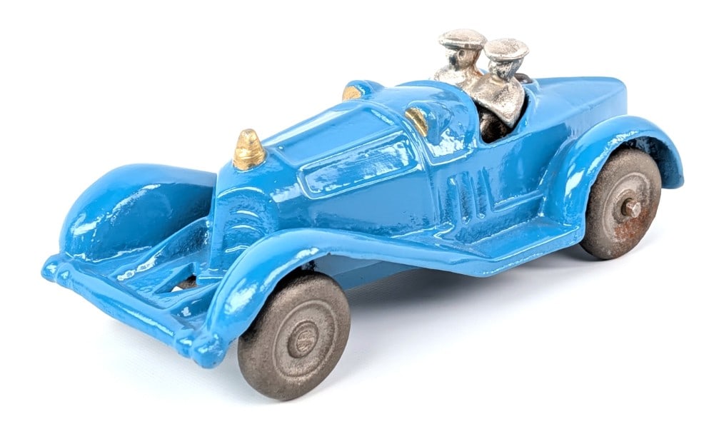 Freidag Cast Iron Racer: Freidag cast iron bobtail racer / roadster. Nice restored condition. The passenger side wheels are loose. Very good restored condition. Measures approximately 6-1/2" long.
