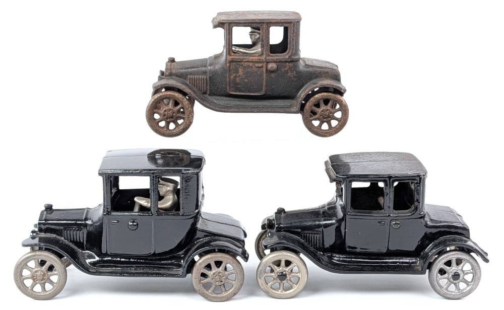 (3) Arcade Cast Iron Ford Coupe: (3) Arcade cast iron Ford Coupes. Includes two restored and one original. One of the restored cars is very dusty / dirty from display. Both restored cars have a couple paint chips. The original is sho
