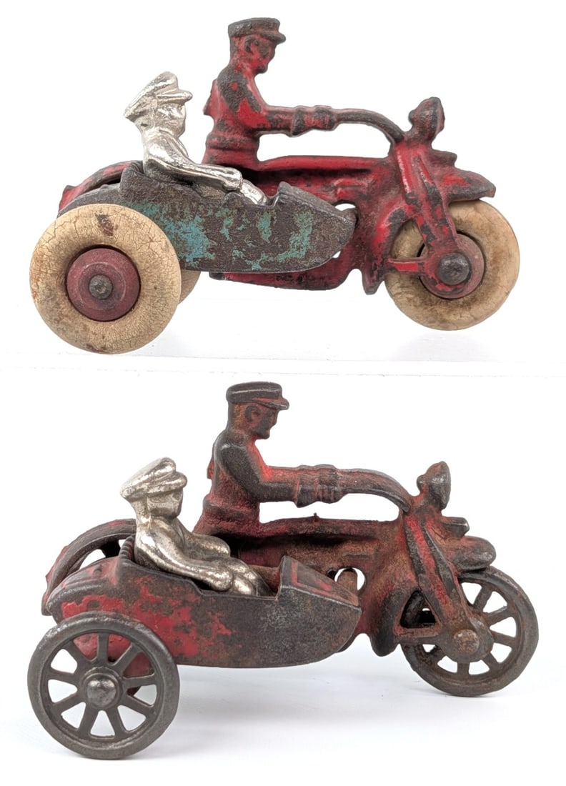 (2) Hubley Cast Iron Cop Motorcycle's with Sidecars: (2) Hubley cast iron cop motorcycle's with sidecars and riders. One original rider and one replacement. One with spoked metal wheels and the other with rubber tires. Both showing paint loss and wear f
