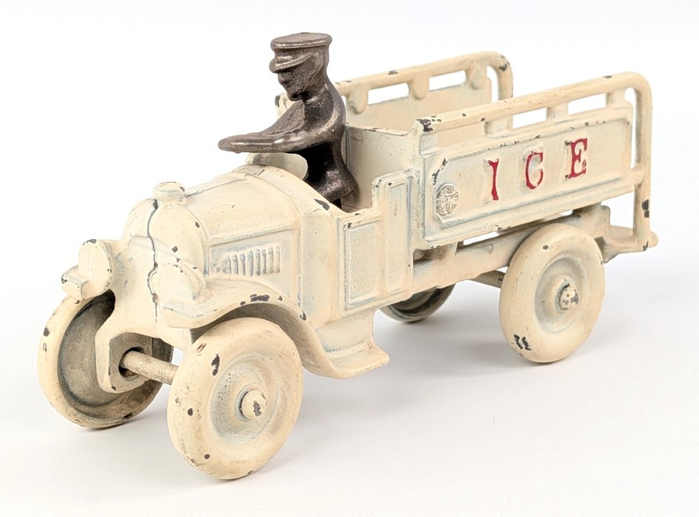 Kenton Cast Iron Ice Truck: Kenton cast iron ice delivery truck. The truck has an older repaint and was aged. The truck has an older replacement driver. Measures approximately 6" long.