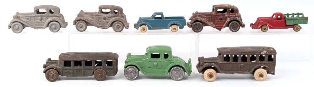 (8) Cast Iron Cars, Trucks, and Buses: (8) Cast iron cars, trucks, and buses. Brands include Arcade, Hubley, and AC Williams. Items vary in condition from restored, partially restored, and original. Largest measures 4-3/4" long.