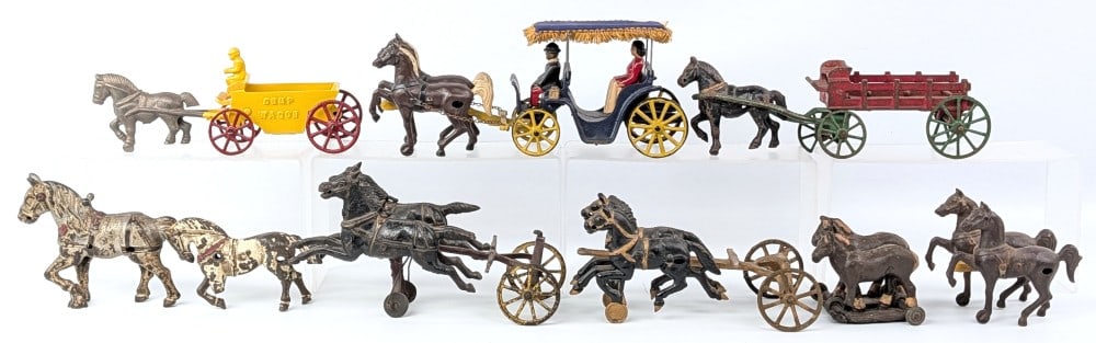 Cast Iron Horse Drawn Parts: Cast iron and cast metal horse drawn parts. Includes teams of horses, Stanley carriage, dump wagon, and stake wagon. Items vary from original to repainted. Some items showing damage or wear from play 