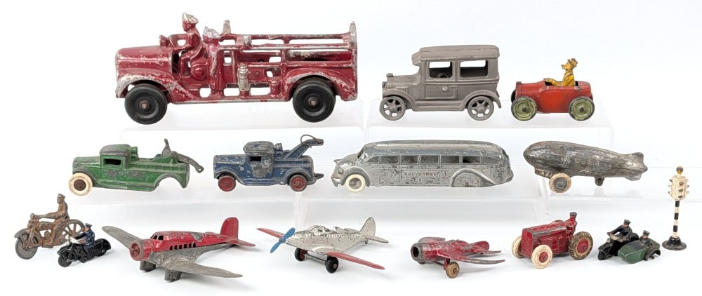 Tootsietoy Andy Gump, Barclay Slush Metal, and Cast Iron Toys: Includes Tootsietoy Andy Gump, Greyhound bus, slush metal blimp, tow trucks, motorcycles, cast aluminum fire truck, airplanes, space rocket, and cast iron coupe. All showing some wear from play and