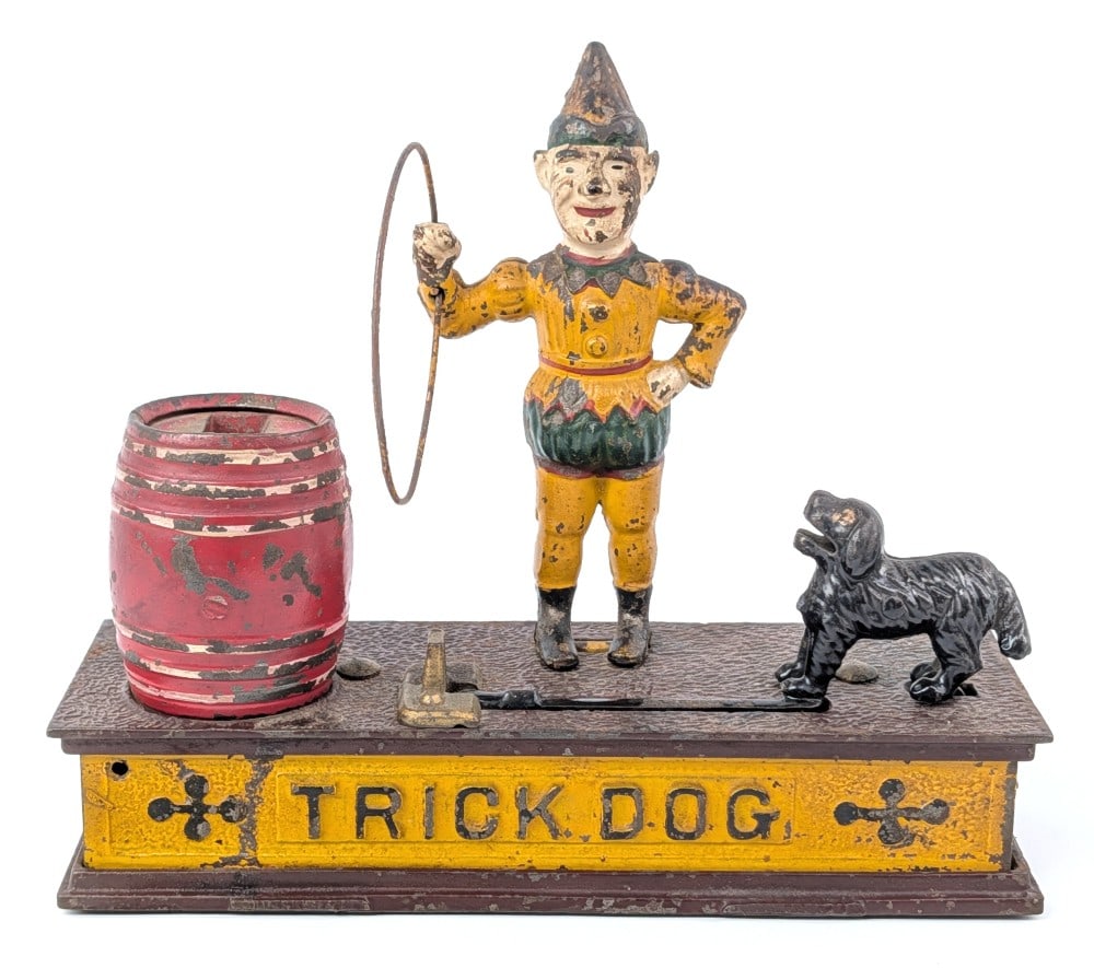 Cast Iron Trick Dog Mechanical Coin Bank: Cast iron Trick Dog mechanical coin bank. Believed to be made by Hubley. Mechanical action is working. Marked on the bottom "PAT. July 31, 1888". Shows paint loss and age wear. Measures approximately 