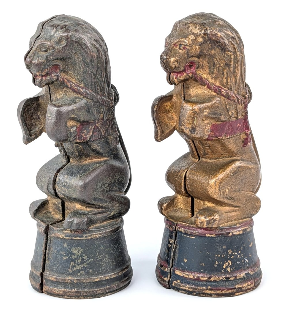 (2) Cast Iron Circus Lion Still Banks: (2) AC Williams cast iron circus lion still banks. Both showing some loss and wear from use. Measures approximately 5-1/2" tall.?