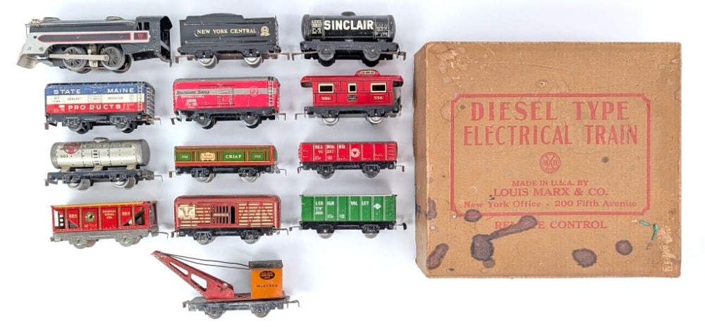 Marx Tinplate Engine, Train Cars, and Set Box: Marx O Gauge tinplate train engine with tender, train cars, and Marx diesel type set box. All the cars are dusty / dirty from storage with scratches and wear from use and age.?