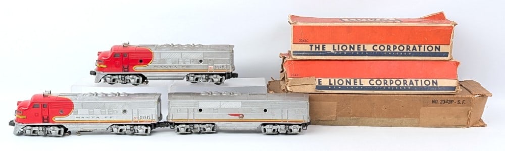 Lionel Santa Fe 2343 ABA Units: Lionel Santa Fe 2343 ABA units. Includes one powered unit and two dummy units. The powered unit shows corrosion to the bottom. All have scratches and wear from use and handling. All come with rough or