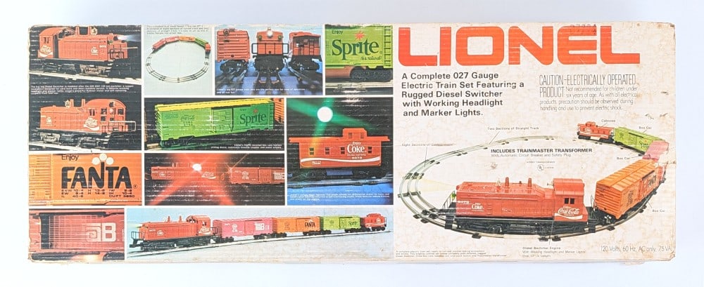 Lionel Coca-Cola Electric Train Set No. 6-1463: Lionel O Gauge Coca-Cola electric train set in the box. Complete with engine, caboose, train cars, track, and transformer. The box shows staining and wear from storage / age.?