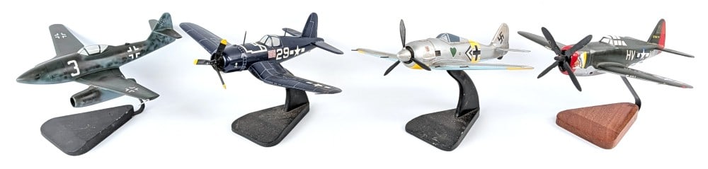 (4) Model Airplane Replicas with Display Stands: (4) Model airplane replicas with display stands. Dusty / dirty from being on display. Nice replicas coming with the display stands. Largest wingspan measures 17" across.?