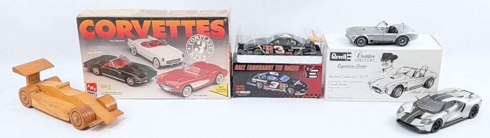 Corvette Kit, Shelby Cobra, Franklin Mint Dale Earnhardt, Ford Gt40: Includes AMT 3-car Corvette model kit, 1/20 scale Shelby Cobra 427 s/c, Franklin Mint Dale Earnhardt tin racer, signed wooden race car, and Ford GT40. All dusty from being on display. The model kit is