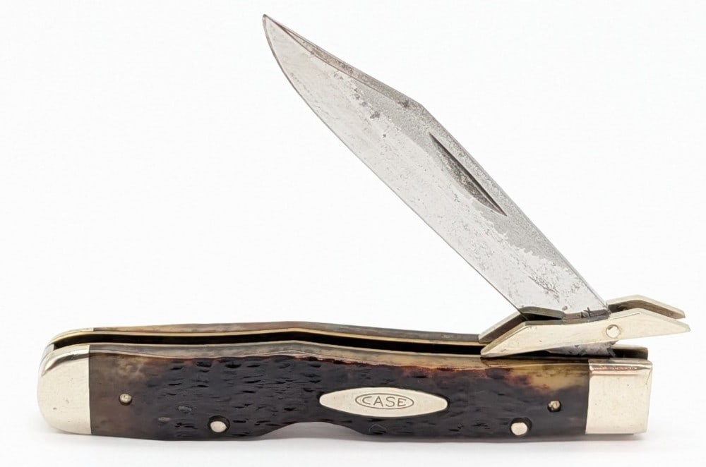 1980 Case XX Jigged Pretty Bone Cheetah 6111 1/2: Knife is in fair condition with scratches and carbon spots on the blade, scratches and tarnishing on the bolsters, and nice handle scales. Overall measures 4-3/8in when closed.