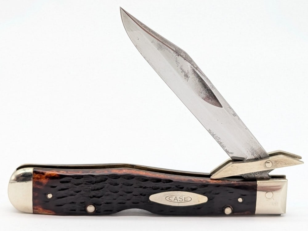 1975 Case XX Jigged Bone Cheetah 6111 1/2: Knife is in good cleaned condition with carbon spots and tarnishing on the blade, scuffs and some tarnishing on the bolsters, and nice handle scales. Overall measures 4-3/8in when closed.