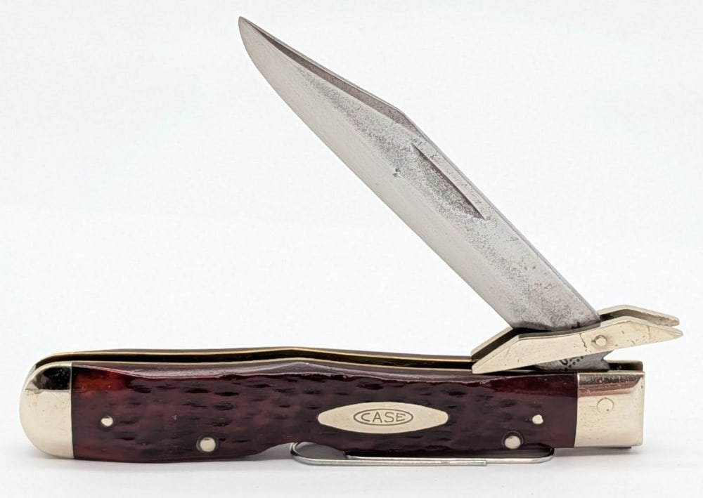1972 Case XX Red Bone Cheetah 6111 1/2: Knife is in fair condition with pitting and scratches on the blade, scuffs and scratches on the bolsters, and a crack on the back handle scales by the lower bolster. Overall measures 4-3/8in when clos