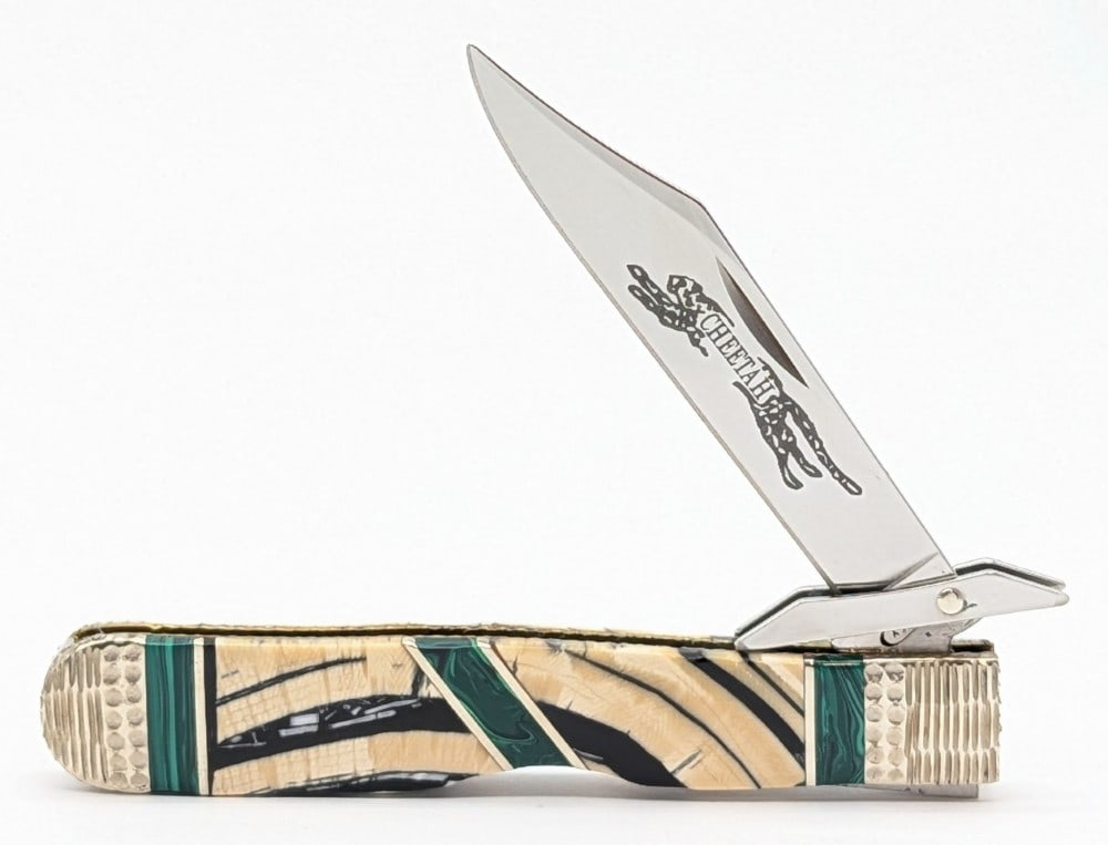 Ltd 2019 Case XX 1 of 5 Michael Prater Signature Series Mammoth Tusk Cheetah: Knife is numbered 1 of 5. Features worked bolsters, and mammoth tusk handle scales with natural stone accents. Knife is in very nice condition with minimal wear from handling. Overall measures 4-3/8in