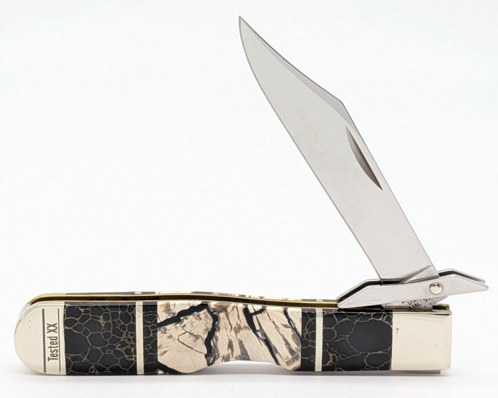2020 Custom Case XX Mammoth Tusk & Black Stone Cheetah 6111 1/2: Knife is in very nice condition with minimal wear from handling. Overall measures 4-3/8in when closed.