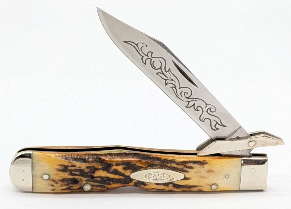1977 Case XX Blue Scroll Stag Cheetah 5111 1/2: Knife is in very nice condition with light scuffs and tarnishing on the bolsters from handling. Overall measures 4-3/8in when closed.