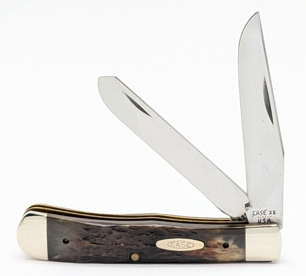 1984 Case XX Jigged Pretty Bone New Grind Trapper 6254: Knife is in good cleaned condition with some light scratches on the polished blades, light scuffs on the bolsters, and nice handle scales. Overall measures 4-1/8in when closed.