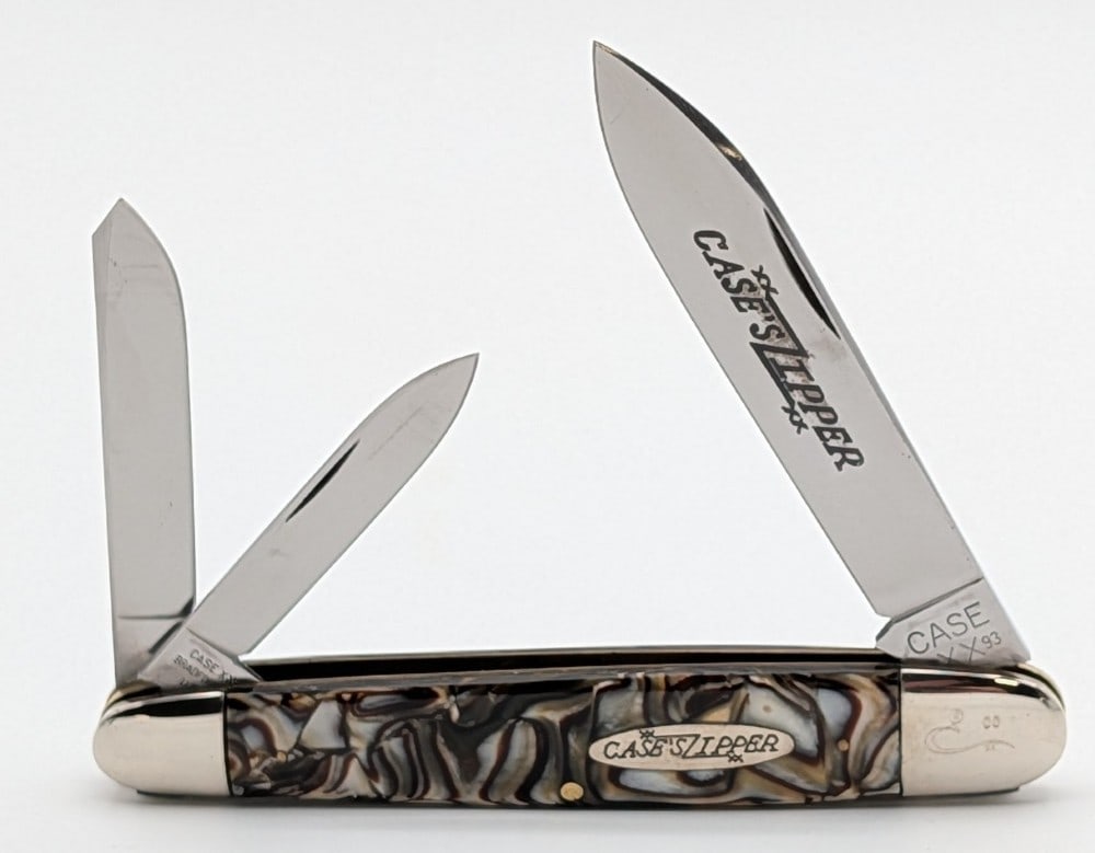 Prototype 1993 Case XX Zipper Caramel Swirl Cigar Whittler 73091: Knife is numbered 00, and is in very nice condition with light scuffs from handling. Overall measures 4-1/2in when closed.