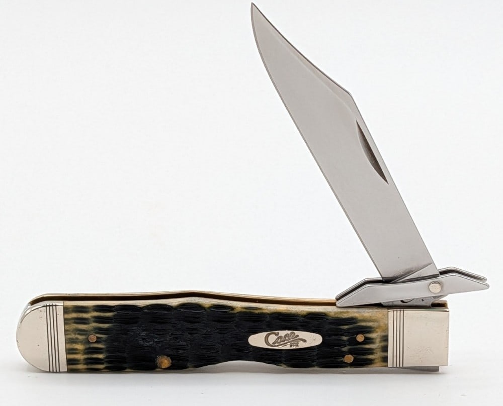 2018 Case XX Olive Green Bone Cheetah 6111 1/2: Knife is in very nice condition with some light tarnishing on the bolsters from handling. Overall measures 4-3/8in when closed.