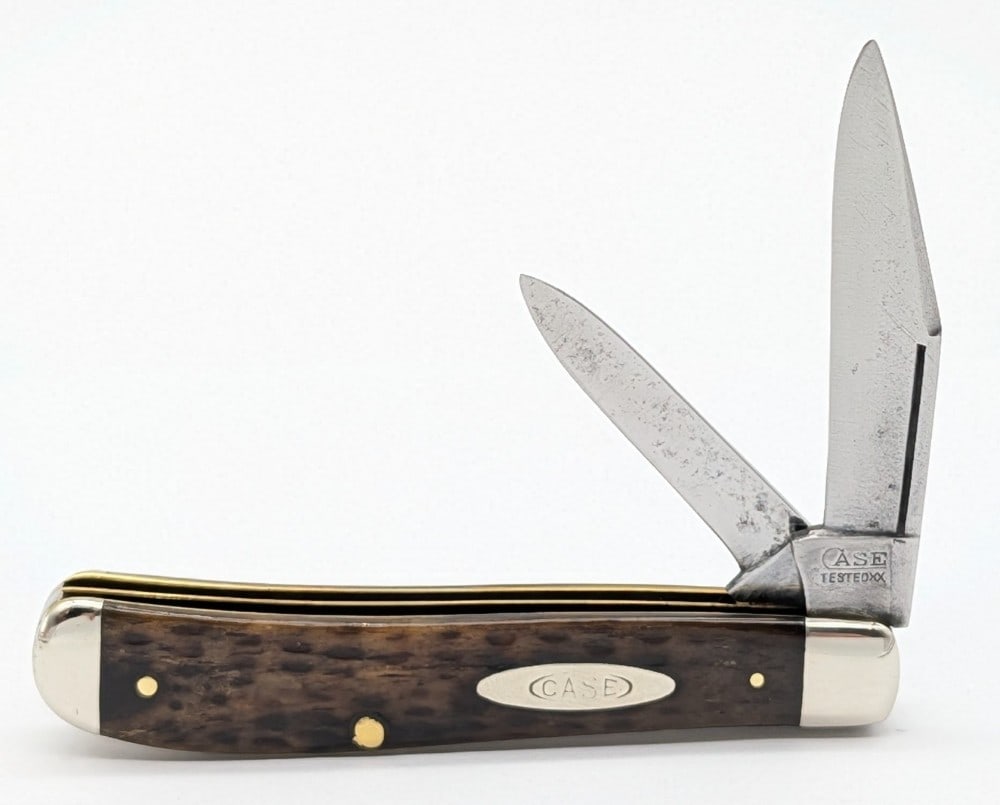 1920-40 Case Tested XX Green Bone Long Pull Mini Trapper: Knife is in used cleaned condition with heavy scratches and material loss on the blades, light scuffs on the polished bolsters, and the front handle scale has a pin crack on the bottom pin. Overall me