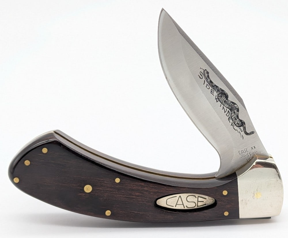 1981 Case XX Smooth Wood Sidewinder: Knife is in nice condition with light scuffs on the bolsters from handling. Overall measures 5-1/4in when closed.