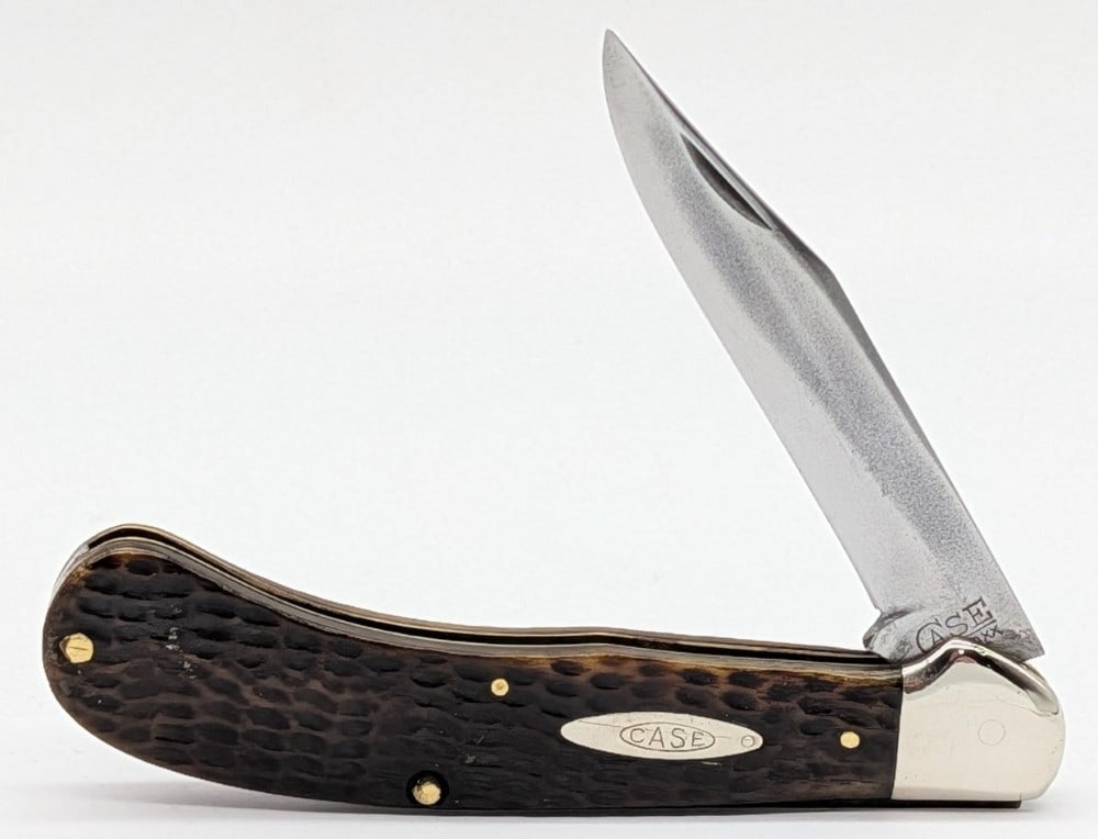 1920-40 Case Tested XX Green Bone Saddlehorn: Knife is in good cleaned condition with material loss and scratches on the polished blade, scuffs on the polished bolsters, and the back handle scale has a repaired chip on the bottom pin and a crack 
