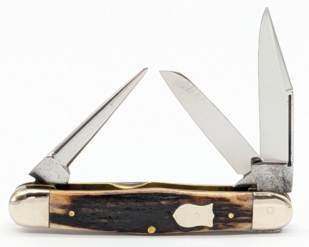 1905-14 W.R. Case & Sons Rehandled Stag Long Pull Swell Center Stockman with Punch: Knife is in good cleaned condition with some material loss and pitting on the polished blades, scuffs on the polished bolsters, and the new handle scales are nice. Overall measures 3-3/8in when closed
