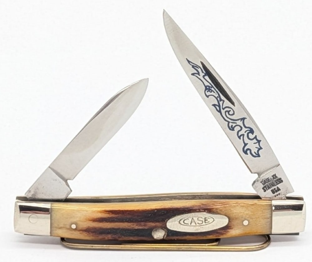 1977 Case XX Blue Scroll Stag Small Stockman 5233: Knife is in very nice condition with light scuffs and tarnishing on the bolsters from handling. Overall measures 2-5/8in when closed.