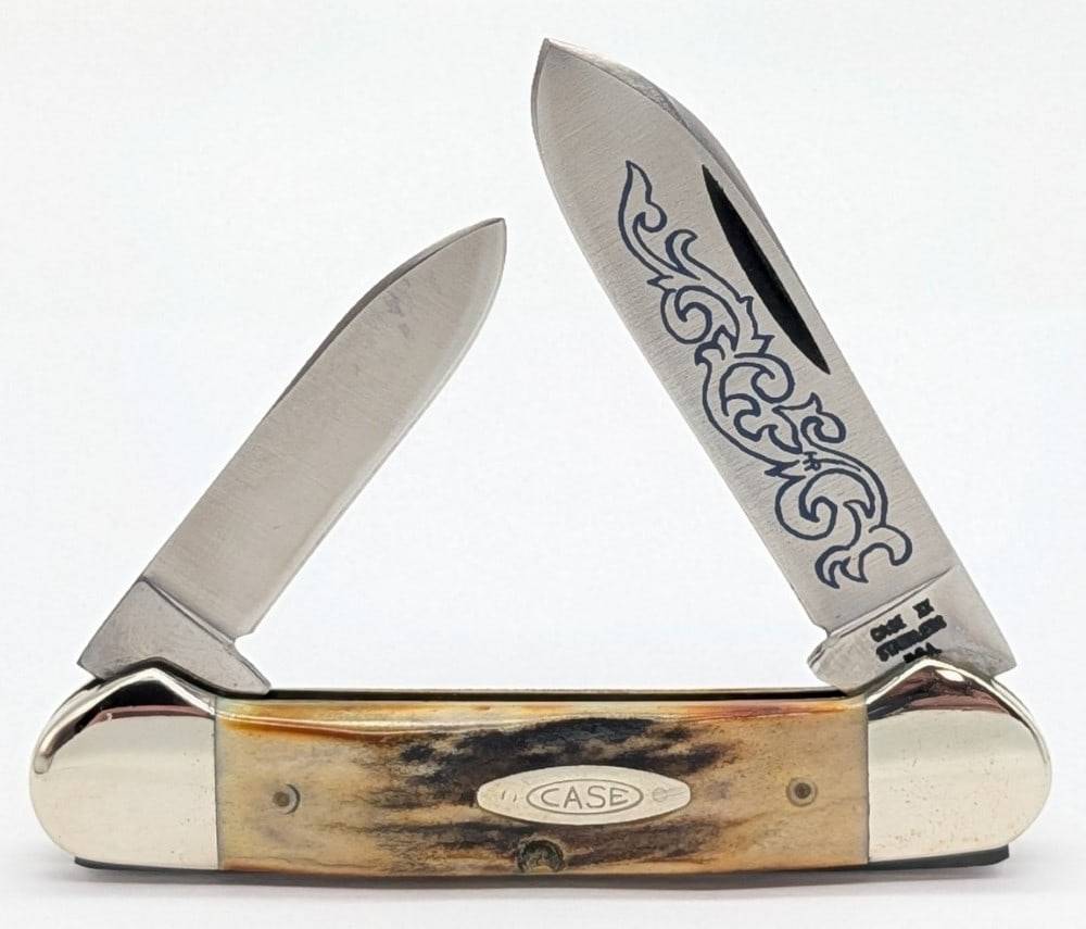 1977 Case XX Blue Scroll Stag Canoe Knife 52131: Knife is in very nice condition with light scuffs and tarnishing on the bolsters from handling. Overall measures 3-5/8in when closed.
