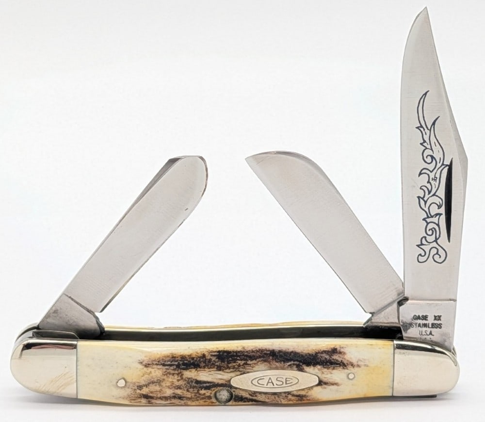 1977 Case XX Blue Scroll Stag Medium Stockman 5347: Knife is in very nice condition with light scuffs and tarnishing on the bolsters from handling, and a pin crack on the front handle scale bottom pin. Overall measures 3-7/8in when closed.