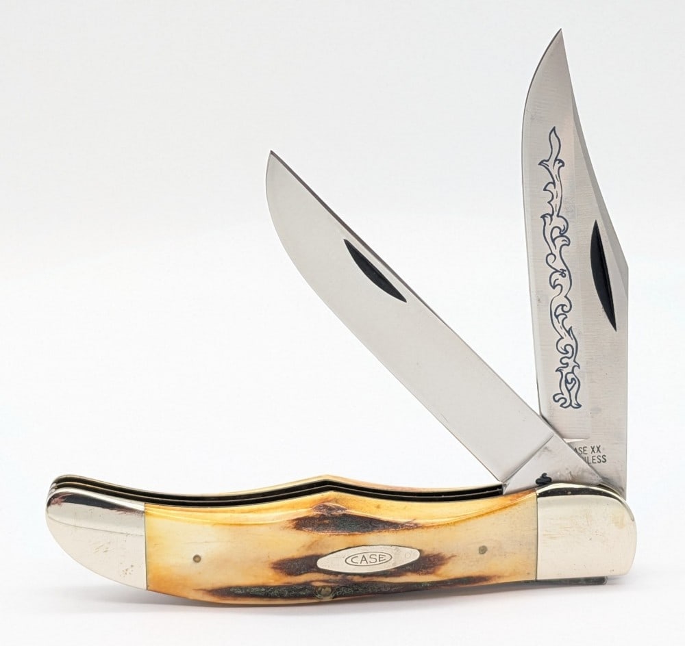 1977 Case XX Blue Scroll Stag Folding Hunter 5265: Knife is in very nice condition with light scuffs and tarnishing on the bolsters from handling. Overall measures 5-1/4in when closed.