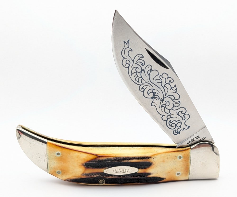1977 Case XX Blue Scroll Stag Large Clasp Knife 5172: Knife is in very nice condition with light scuffs and tarnishing on the bolsters from handling. Overall measures 5-3/8in when closed.