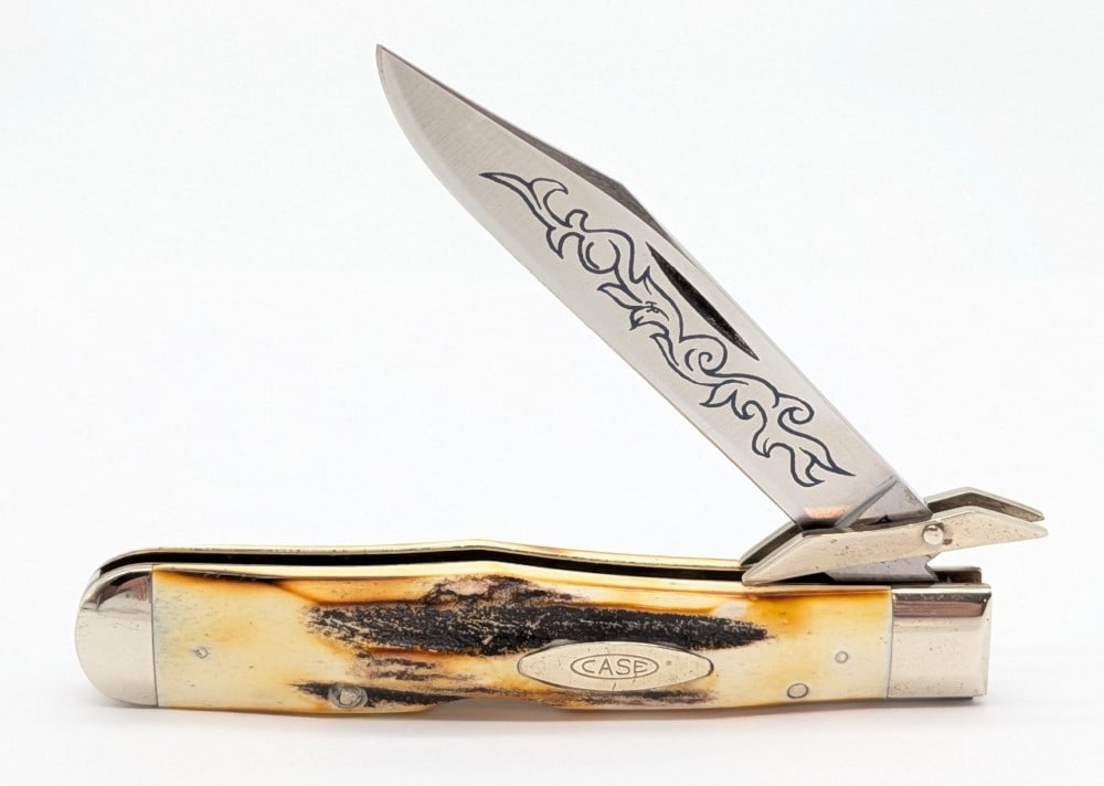 1977 Case XX Blue Scroll Stag Cheetah 5111 1/2: Knife is in very nice condition with light scuffs and tarnishing on the bolsters from handling. Overall measures 4-3/8in when closed.