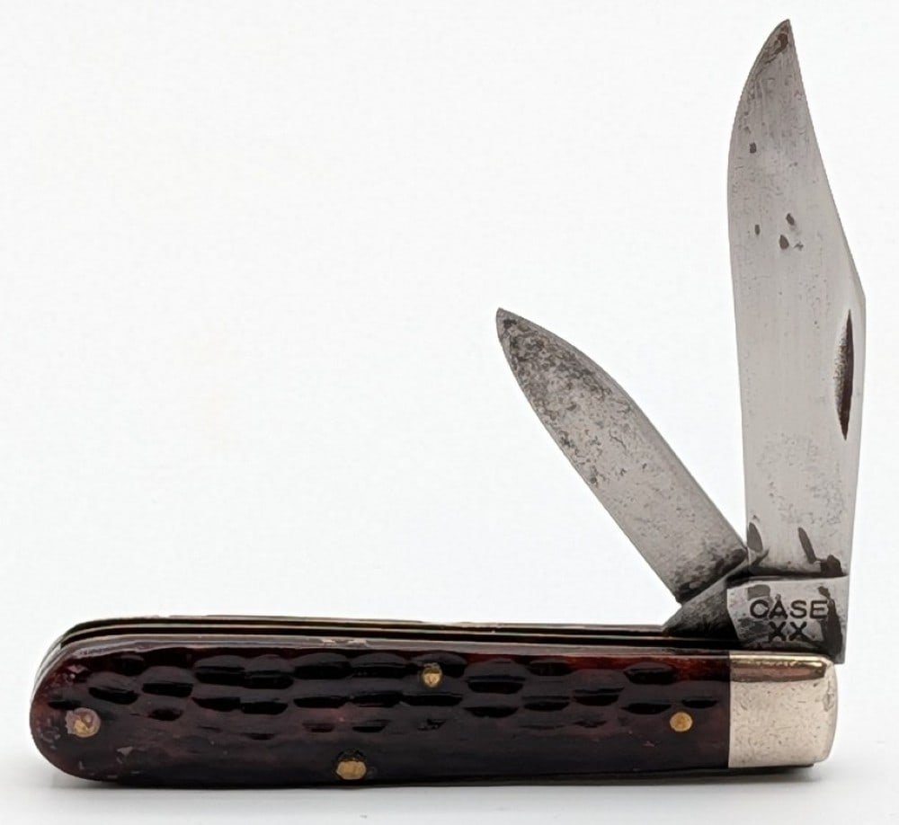 1940-64 Case XX Jigged Bone Bare Headed Jack Knife: Knife is in aged condition with material loss and scratches on the blades, scuffs and scratches on the bolsters, and multiple cracks and repairs on both the front and back handle scales. Overall measu