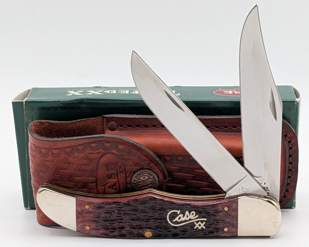 2002 Case XX Silver Script Cranberry Bone Folding Hunter 6265 w/ Sheath & Box: Knife is in like new condition. Overall measures 5-1/4in when closed.