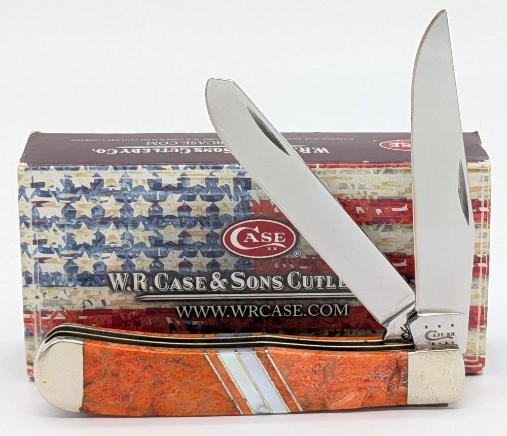 2013 Case XX Exotic Orange Coral Trapper EX254 w/ Box: Knife is in very nice condition with light scuffs and some tarnishing on the bolsters from handling. Overall measures 4-1/8in when closed.