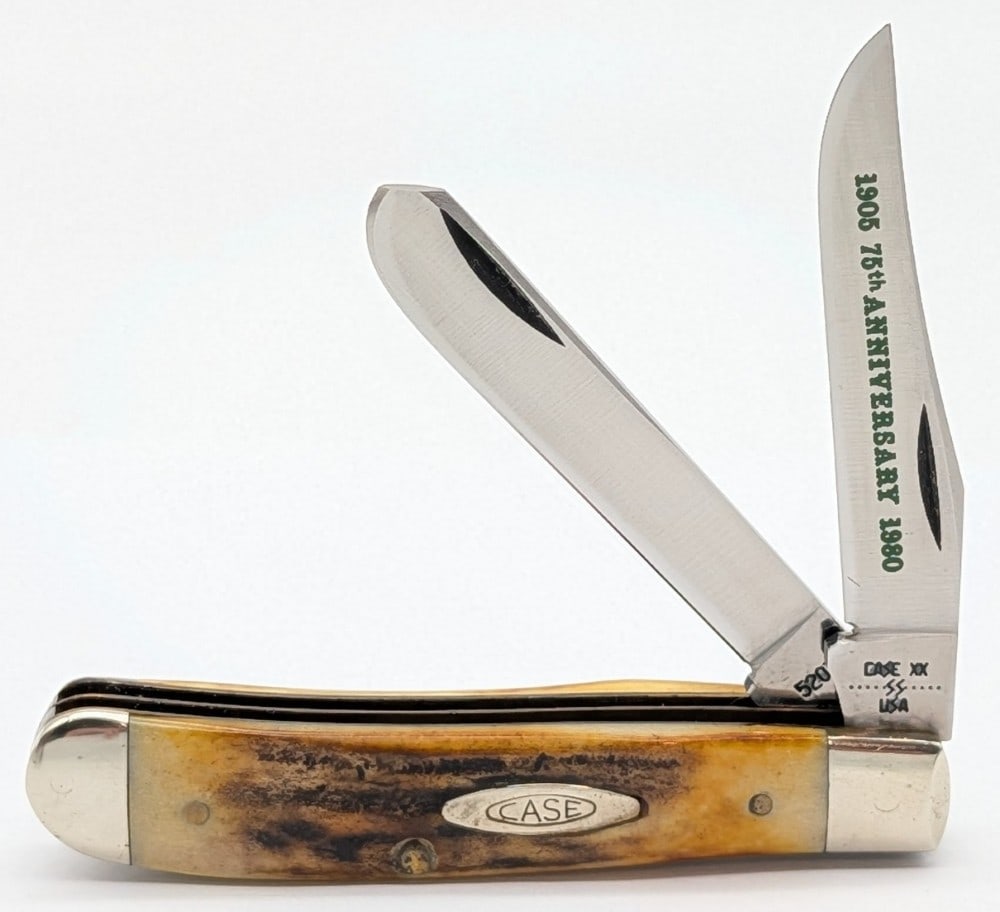 1980 Case XX 75th Anniversary Stag Mini Trapper 5207: Knife is in fair cleaned condition with scuffs and some tarnishing on the bolsters, and heavy cleaned pitting along the leaf springs. Overall measures 3-1/2in when closed.